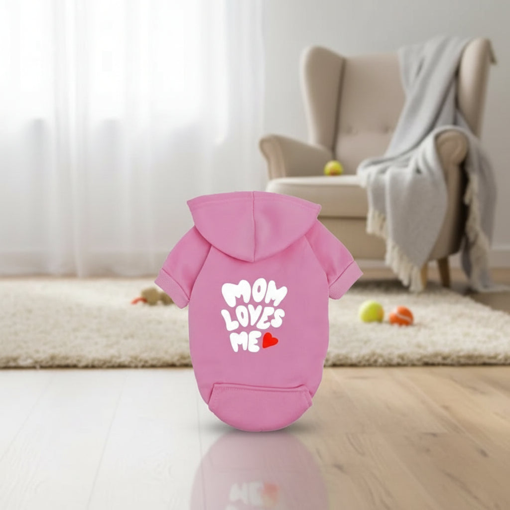 A delicate hoodie crafted for the most cherished pups, this piece wraps your dog in gentle warmth while adding a touch of everyday luxury.
The bold “Mom Loves Me” print and tiny red heart celebrate the special bond between you and your fur baby.