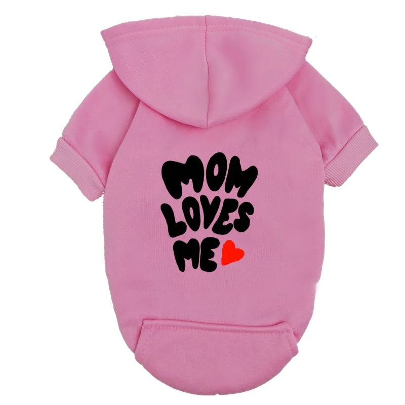 A delicate hoodie crafted for the most cherished pups, this piece wraps your dog in gentle warmth while adding a touch of everyday luxury.
The bold “Mom Loves Me” print and tiny red heart celebrate the special bond between you and your fur baby.