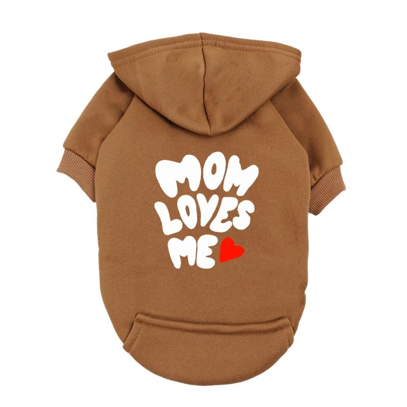 A delicate hoodie crafted for the most cherished pups, this piece wraps your dog in gentle warmth while adding a touch of everyday luxury. The bold “Mom Loves Me” print and tiny red heart celebrate the special bond between you and your fur baby. - Luxempirez