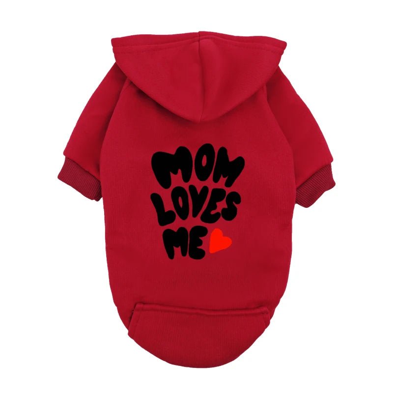 A delicate hoodie crafted for the most cherished pups, this piece wraps your dog in gentle warmth while adding a touch of everyday luxury. The bold “Mom Loves Me” print and tiny red heart celebrate the special bond between you and your fur baby. - Luxempirez