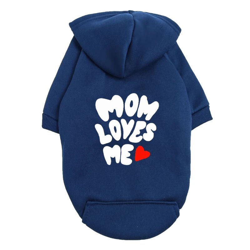 A delicate hoodie crafted for the most cherished pups, this piece wraps your dog in gentle warmth while adding a touch of everyday luxury. The bold “Mom Loves Me” print and tiny red heart celebrate the special bond between you and your fur baby. - Luxempirez