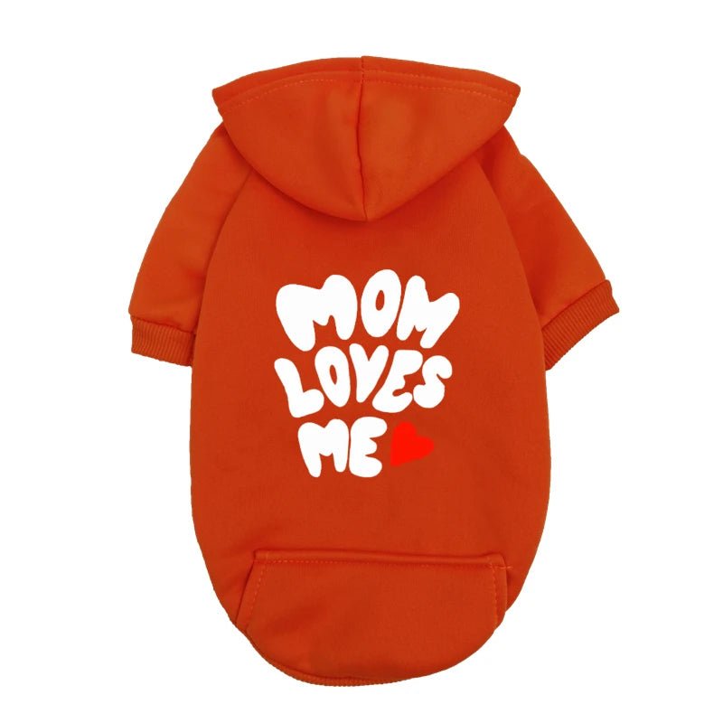 A delicate hoodie crafted for the most cherished pups, this piece wraps your dog in gentle warmth while adding a touch of everyday luxury. The bold “Mom Loves Me” print and tiny red heart celebrate the special bond between you and your fur baby. - Luxempirez