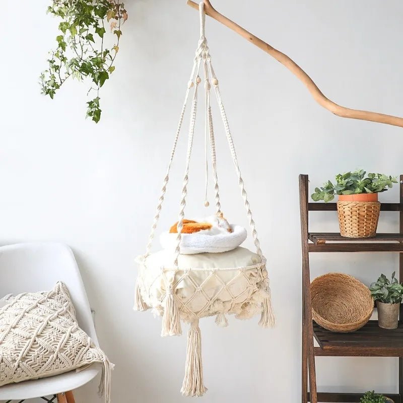 Give your feline a sanctuary in the sky with this hand‑woven luxury cat hammock, designed to float elegantly in your home like a piece of boho décor. The soft, suspended nest cradles your cat in complete comfort, while the exquisite macramé detailing. - Luxempirez