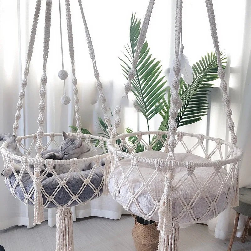 Give your feline a sanctuary in the sky with this hand‑woven luxury cat hammock, designed to float elegantly in your home like a piece of boho décor. The soft, suspended nest cradles your cat in complete comfort, while the exquisite macramé detailing. - Luxempirez