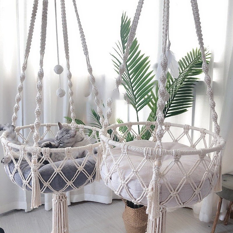 Give your feline a sanctuary in the sky with this hand‑woven luxury cat hammock, designed to float elegantly in your home like a piece of boho décor. The soft, suspended nest cradles your cat in complete comfort, while the exquisite macramé detailing. - Luxempirez