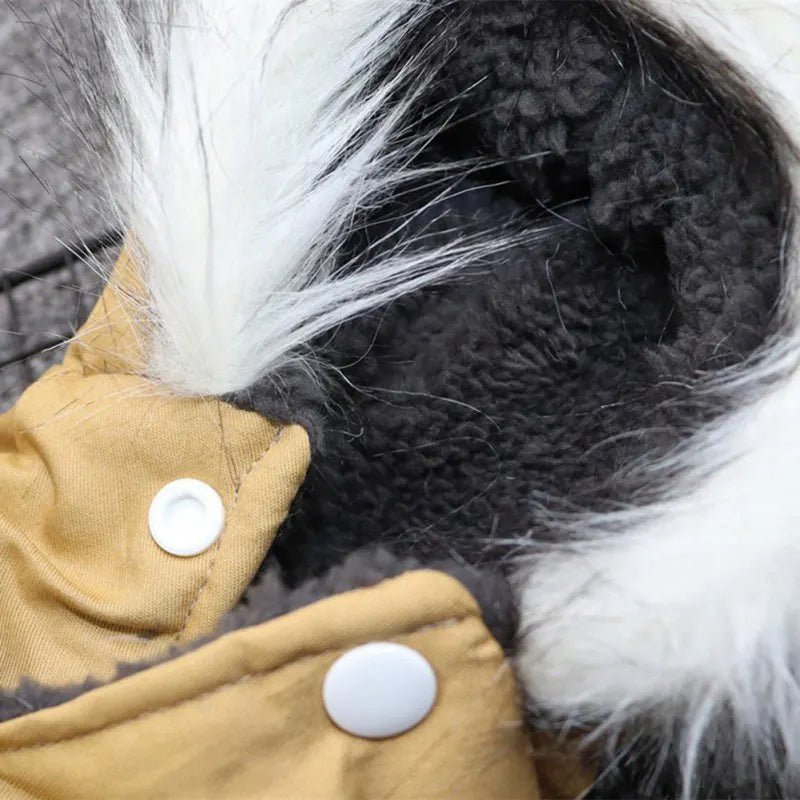 Indulge your canine companion with this exquisite dog jacket, designed for ultimate comfort and style. With its plush fleece lining and sophisticated faux fur hood trim, this piece combines warmth and elegance to perfection. - Luxempirez