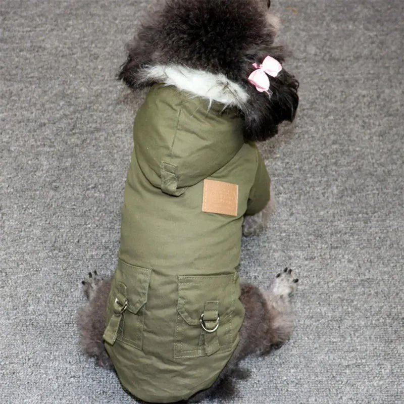 Indulge your canine companion with this exquisite dog jacket, designed for ultimate comfort and style. With its plush fleece lining and sophisticated faux fur hood trim, this piece combines warmth and elegance to perfection. - Luxempirez