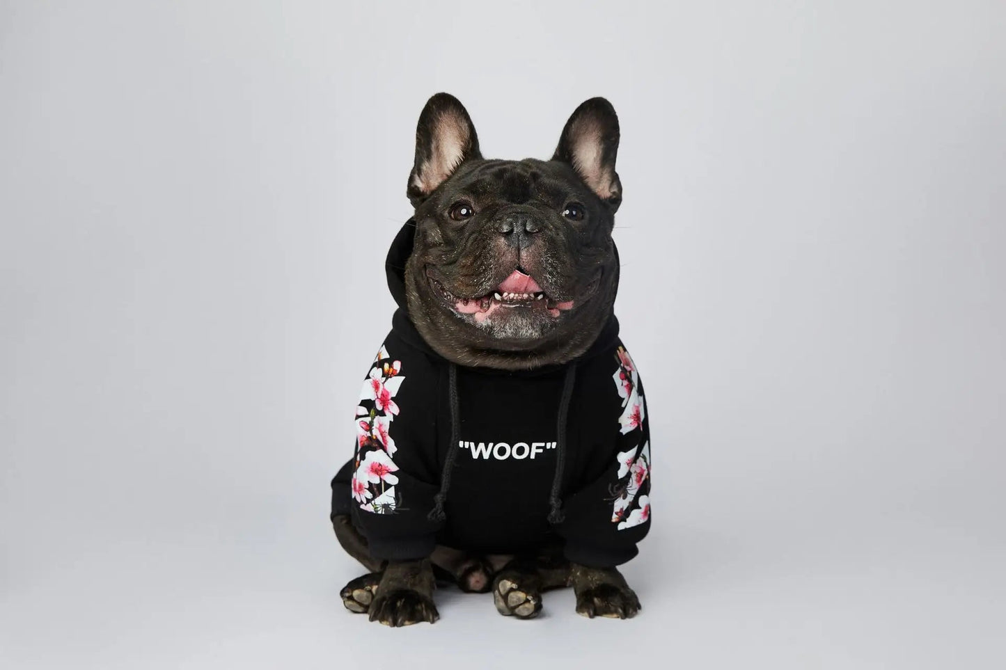 Let your dog make a statement in this luxurious black hoodie, adorned with intricate floral motifs and bold design accents front and back. The high - quality fabric ensures lasting comfort and warmth, while the unique aesthetic featuring "WOOF". - Luxempirez