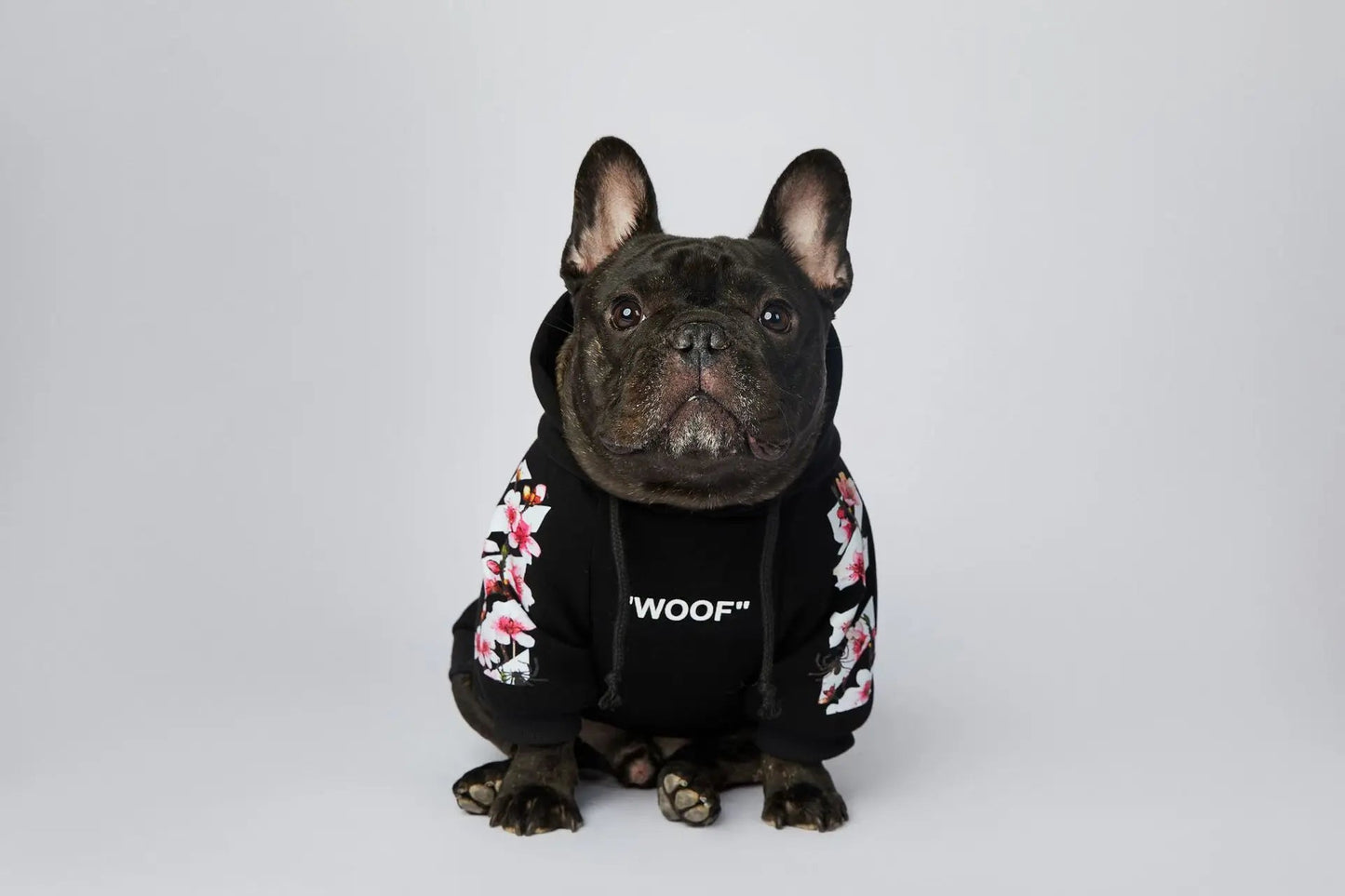 Let your dog make a statement in this luxurious black hoodie, adorned with intricate floral motifs and bold design accents front and back. The high - quality fabric ensures lasting comfort and warmth, while the unique aesthetic featuring "WOOF". - Luxempirez