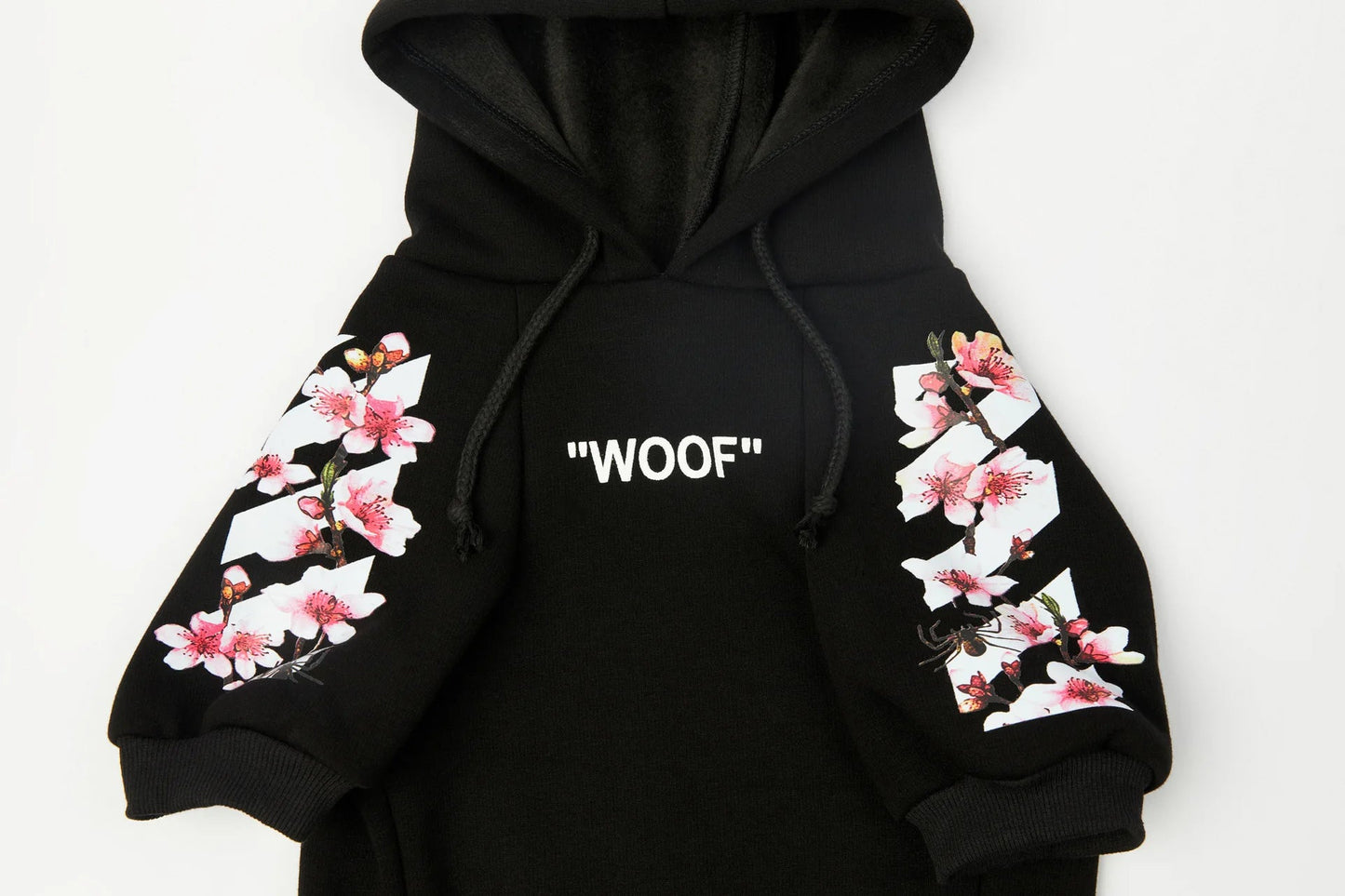 Let your dog make a statement in this luxurious black hoodie, adorned with intricate floral motifs and bold design accents front and back. The high - quality fabric ensures lasting comfort and warmth, while the unique aesthetic featuring "WOOF". - Luxempirez