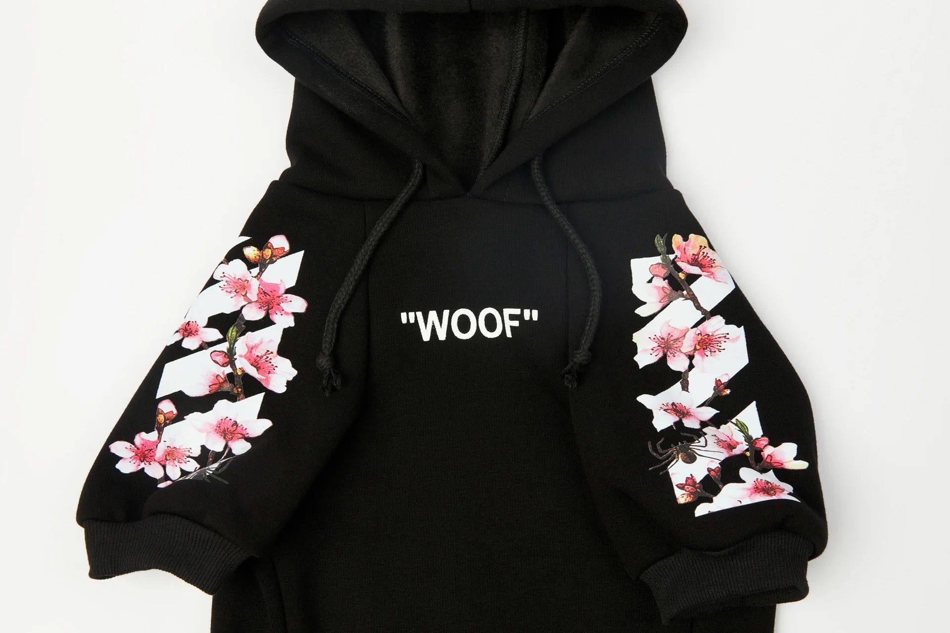 Let your dog make a statement in this luxurious black hoodie, adorned with intricate floral motifs and bold design accents front and back. The high - quality fabric ensures lasting comfort and warmth, while the unique aesthetic featuring "WOOF". - Luxempirez