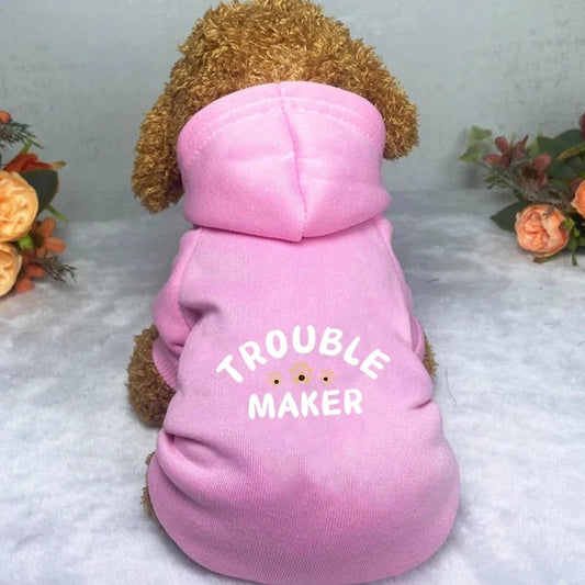 This adorable "Trouble Maker" dog hoodie is perfect for playful pups who love to stand out! Made from soft, comfortable fabric in a cute pink color, this stylish sweatshirt keeps your furry friend warm and cozy while adding a touch of humor to every walk. - Luxempirez