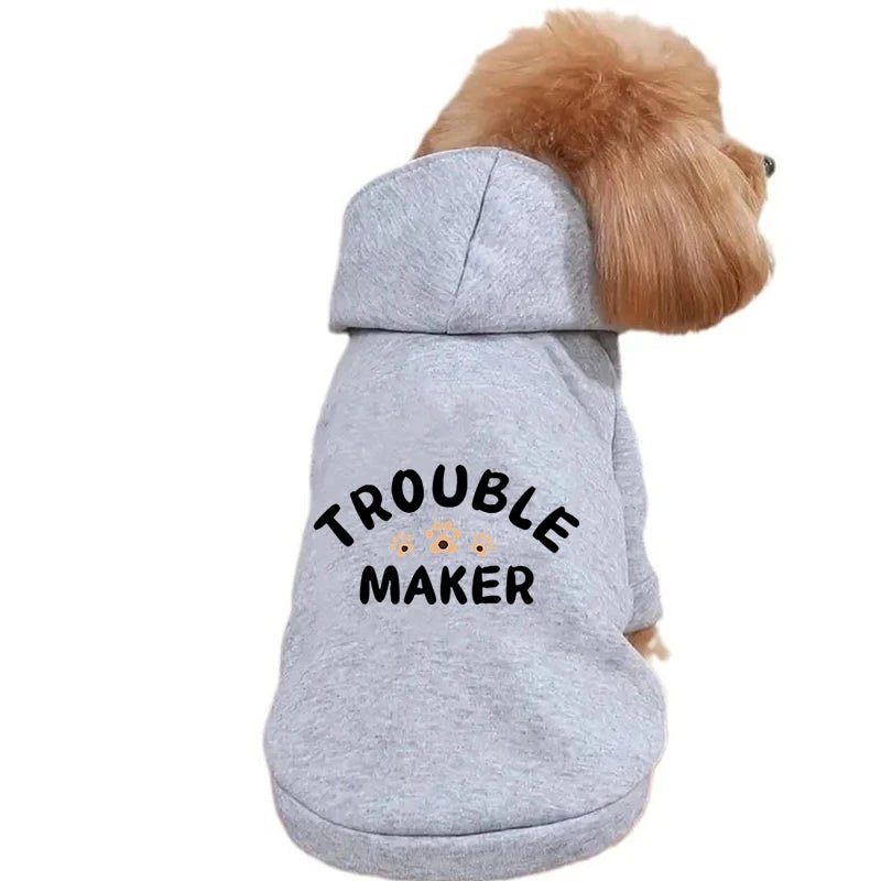 This adorable "Trouble Maker" dog hoodie is perfect for playful pups who love to stand out! Made from soft, comfortable fabric in a cute pink color, this stylish sweatshirt keeps your furry friend warm and cozy while adding a touch of humor to every walk. - Luxempirez